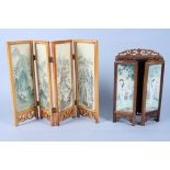 A Chinese hardwood three-panel folding table screen, the panels decorated with figures painted on