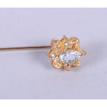 A gold and citrine bar brooch, a gold and topaz bar brooch and a gilt metal stick pin, set aqua