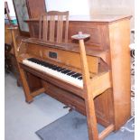 A Bechstein upright piano, in Arts & Crafts oak case designed by Walter Crane, with strap hinges and