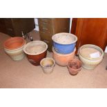 A collection of stoneware and other garden planters, various