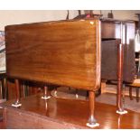 A Georgian mahogany drop leaf dining table, on pole turned supports and pad feet, 42" wide