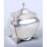 A George V silver tea caddy of rounded rectangular form, on lion paw feet, 4" wide, 6oz troy approx