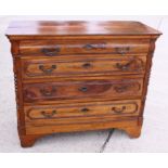 A Continental walnut chest of four long drawers, on bracket feet, 46" wide