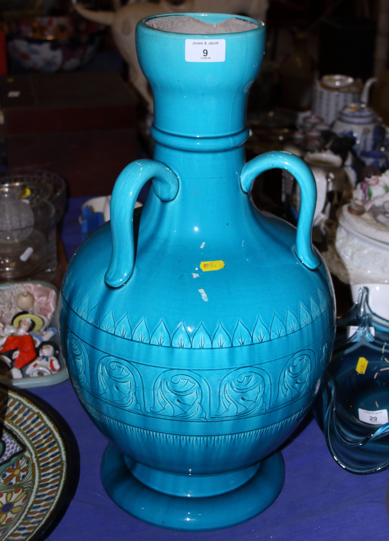 A Burmantofts faience three-handled pottery vase, 22" high