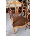 A late 18th century provincial oak and beech panel seat dining chair of Hepplewhite design