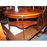 A mahogany oval two-tier coffee table, 28" x 18", and a two-tier occasional table, 22" dia