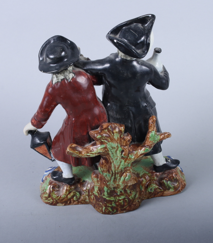 An 18th century Staffordshire model of The Drunken Cleric and his Clerk, on scrollwork base, 9 1/ - Image 2 of 4