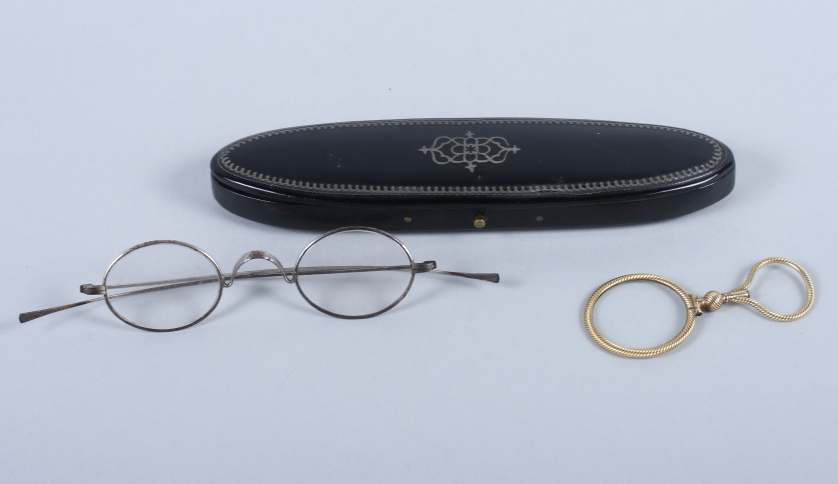 A pair of 19th century white metal spectacles, in papier-mache case, and a 19th century yellow metal