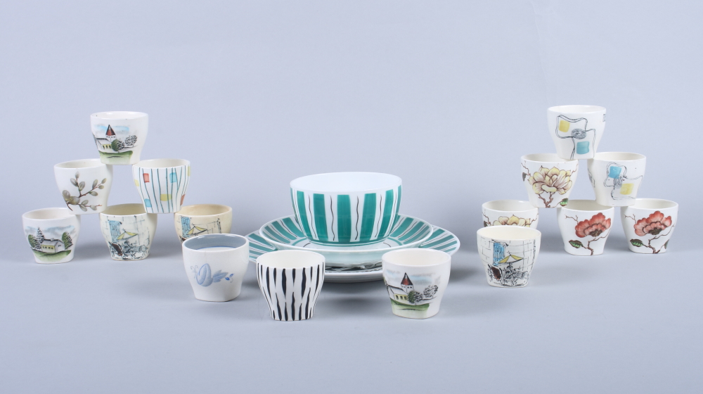 Sixteen Midwinter egg cups, including "Riviera", "Ming Tree" and various other patterns, together