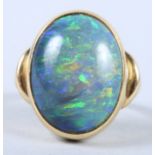 An 18ct gold ring set oval opal, ring size M, 8.5g gross