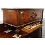 An American walnut blanket box with carved front