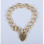 An 18ct gold curb link bracelet with heart-shaped clasp, 35.4g