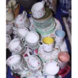 A Minton "Haddon Hall" porcelain tea service and a Susie Cooper porcelain coffee set, painted with