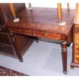 An early Victorian walnut drop leaf side table, fitted two drawers, on fluted supports, 34" wide