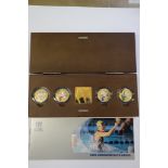 A Commonwealth Games piedfort four silver coin and medallion collection, in wooden case