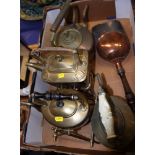 An Art Nouveau brass spirit kettle, on stand, two other spirit kettles and a copper shovel