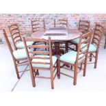 A set of eight oak ladder back dining chairs with drop-in seats, on turned and stretchered supports