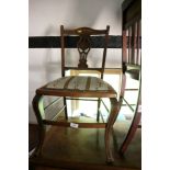 Two Edwardian walnut and line inlaid bedroom chairs with needlepoint seats