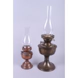 Two oil lamps with chimneys