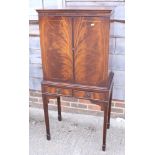 A Georgian design mahogany cocktail cabinet, fitted two shallow drawers