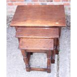 A nest of three Brights of Nettlebed oak occasional tables, on turned and stretchered supports,