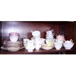 A mid 20th century pink and gilt porcelain part tea service, together with other teawares and