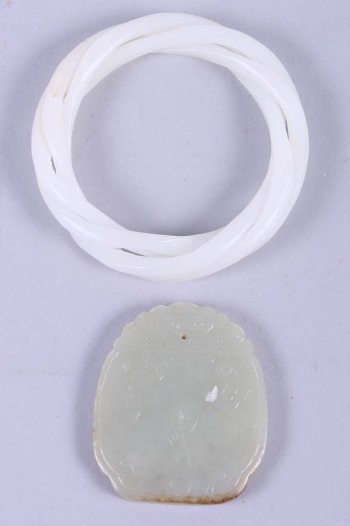 A 19th century Chinese jade pendant, the obverse incised carved with figure sitting under a tree,