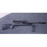 A Hambuli "850 Magnum" 0.177 compressed gas rifle with telescopic sight, stand and "silencer", in