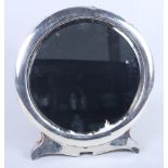 A large circular silver easel mirror with bevelled plate, 12 1/2" high