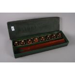 A set of early 20th century mahogany and ivory table billiard bowls, in original box