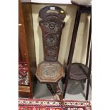 An early 20th century oak spinning chair, on splay supports