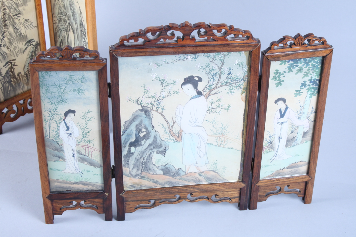 A Chinese hardwood three-panel folding table screen, the panels decorated with figures painted on - Image 2 of 3