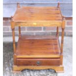 A yew wood two-tier lamp table, fitted one drawer, on bracket supports, 18" wide