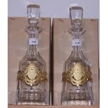 A pair of silver mounted decanters for Winchester College, complete with original packaging, 13 1/2"