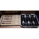 A set of six silver cased teaspoons and set of six silver handled tea knives, 2.2oz troy approx