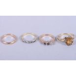 An 18ct gold seven stone diamond ring, an 18ct gold dress ring (two diamonds missing), a 9ct gold