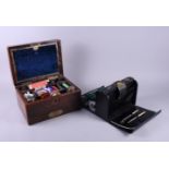 A late Victorian rosewood sewing box, complete with accessories, and a leather folding writing slope