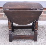 An oak drop leaf coffee table on turned and stretchered supports, 19" wide, and a mahogany wine