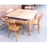 A pine kitchen table, fitted one drawer, on turned and tapering supports, 40" square