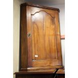 A fruitwood corner hanging cupboard enclosed arched panel door, 26" wide