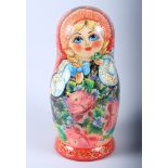 A Russian Matryoshka nesting doll, largest 13 1/2" high