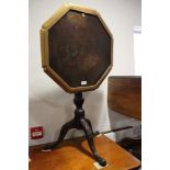 A George III mahogany octagonal tilt top occasional table, on spiral turned column and carved tripod