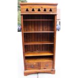 A pine open bookcase, fitted shelves over two drawers, 37" wide