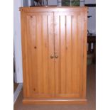 A pine side cupboard enclosed two doors, 37" wide