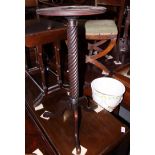 A Georgian design mahogany kettle stand, on spiral turned support and tripod splay feet, 12" dia