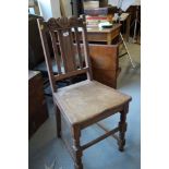 A carved oak side chair, the top rail inscribed "J Bromley 1925 - 1930", and two cased butterflies