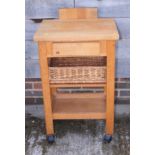 A butcher's modern beech table with knife block and basket undertier, and a pine corner cupboard