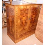 A burr walnut and inlaid television cabinet, with Latin inscription "Open the Doors and see the