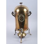 A brass tea or coffee urn with turned and ebonised handles, on stand and burner