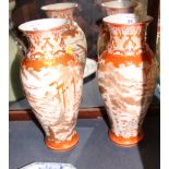 A pair of late 19th century Kutani vases, decorated with figures in landscapes, 12" high